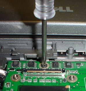 Hidden screw under the display panel plug